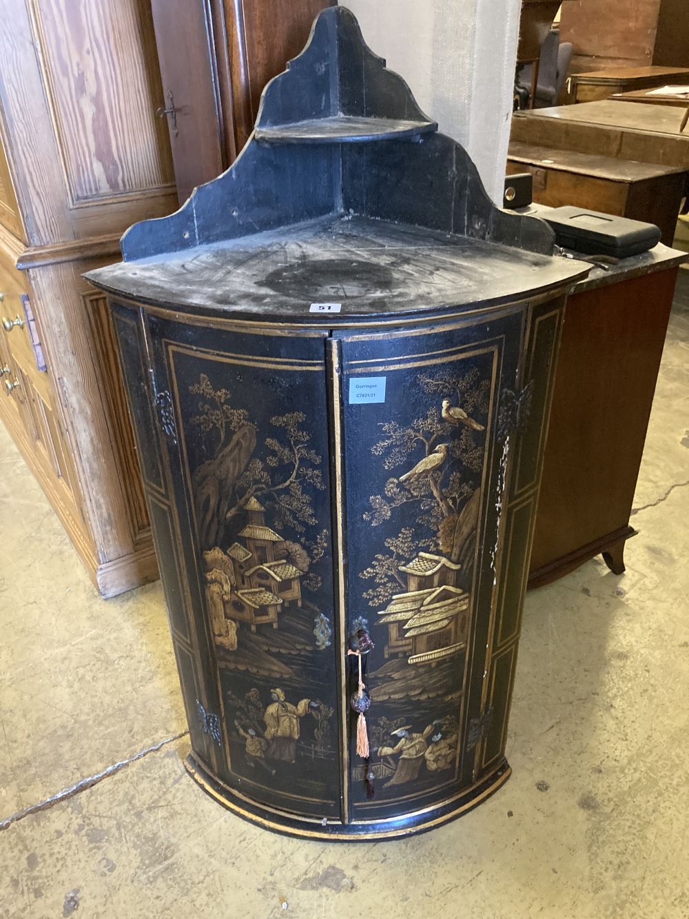 A George III black and gilt chinoiserie lacquered bow fronted hanging corner cupboard, width 60cm, depth 40cm, height 117cm